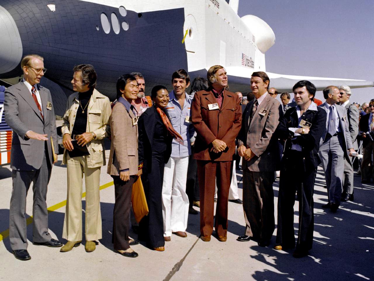 Watercolor drawing of purple grapes on a vine.